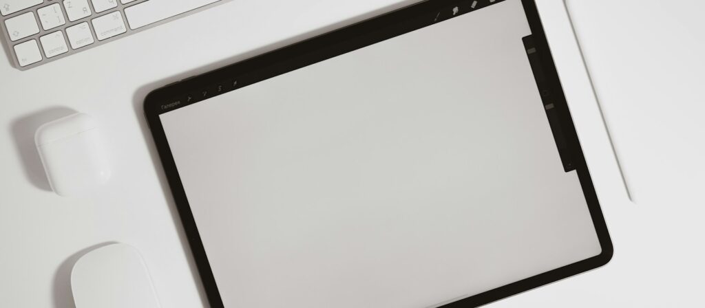 black ipad on white table