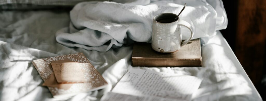 white and gray bed sheet