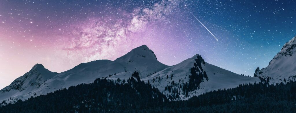 snow mountain under stars